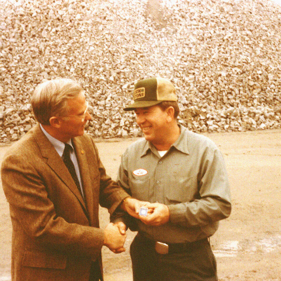 Charles Luck III giving employee (Lee) a service award